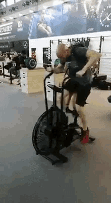 gif showing someone riding an exercise bike really dramatically